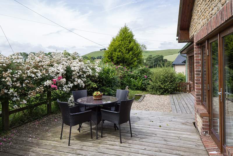 The lovely sheltered terrace has unspoilt countryside views, perfect for al fresco dining.