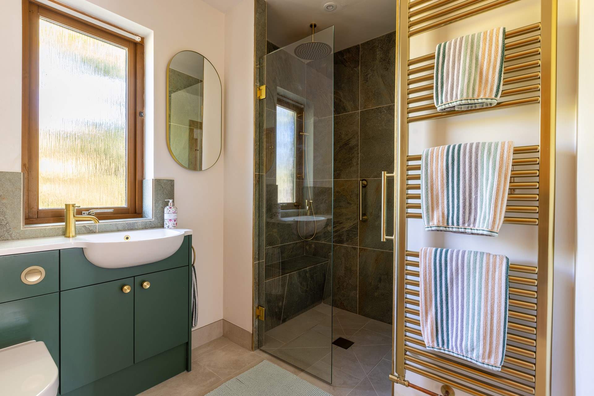 The large wet-room can be accessed via the bathroom, or directly from the hallway.
