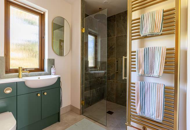 The large wet-room can be accessed via the bathroom, or directly from the hallway.