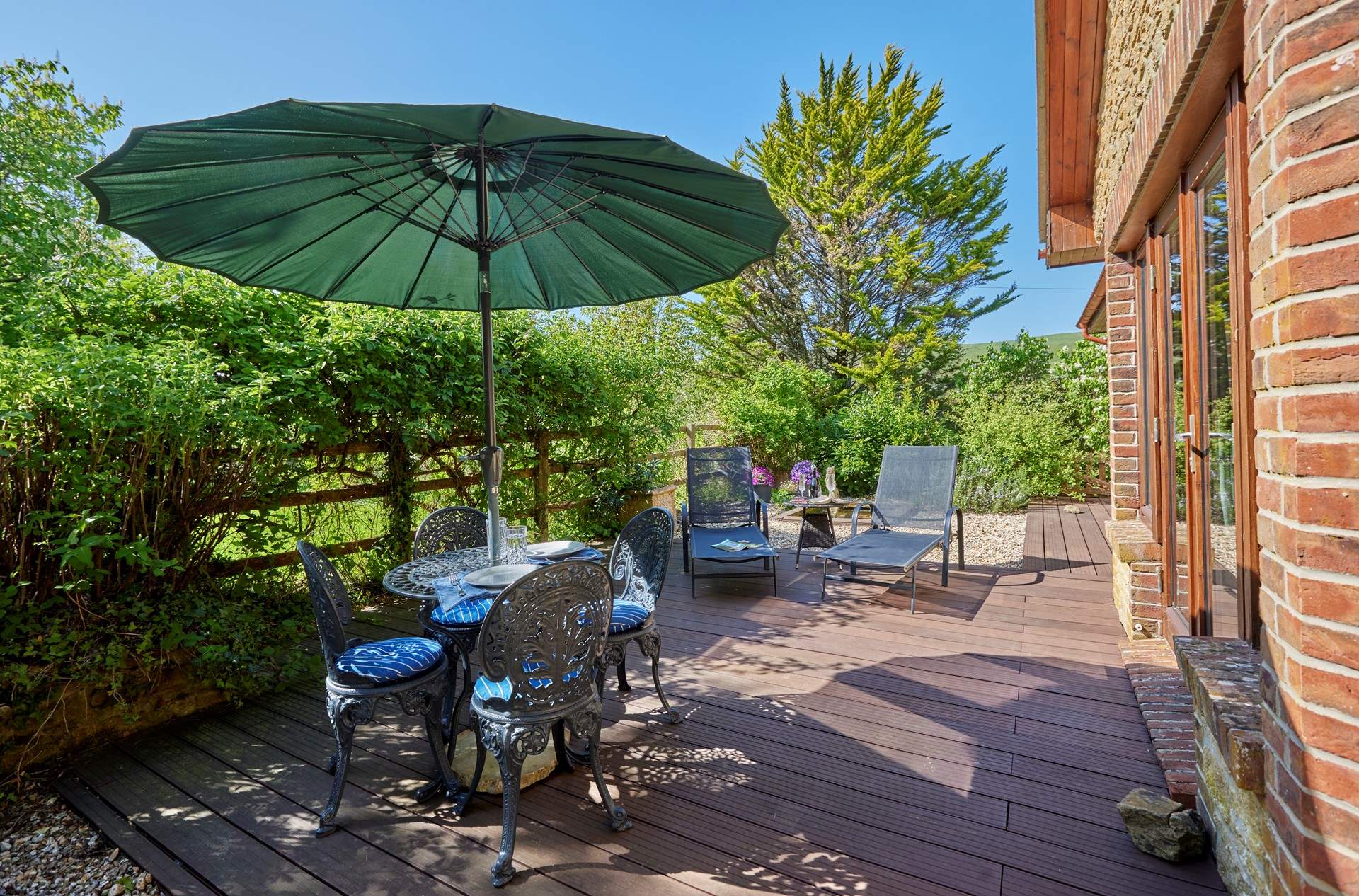 The lovely sunny terrace has unspoilt countryside views, perfect for al fresco dining.