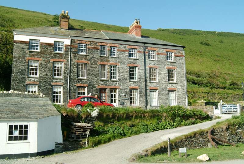 Captain's Retreat is a terraced property. The white painted front door is just above the bonnet of the red car.
