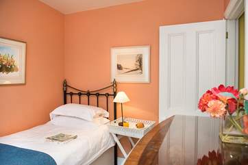 The pretty single bedroom on the first floor.