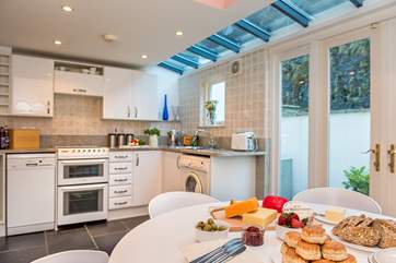 The stylish breakfast/dining-room is wonderfully light and airy.