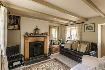 The sitting-room has an open fire which makes Filkins Cottage a great place to stay all year round.