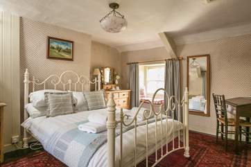The second double bedroom has a lovely bedstead.