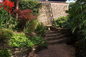 This tranquil place to sit is tucked away in a little corner next to the stream.