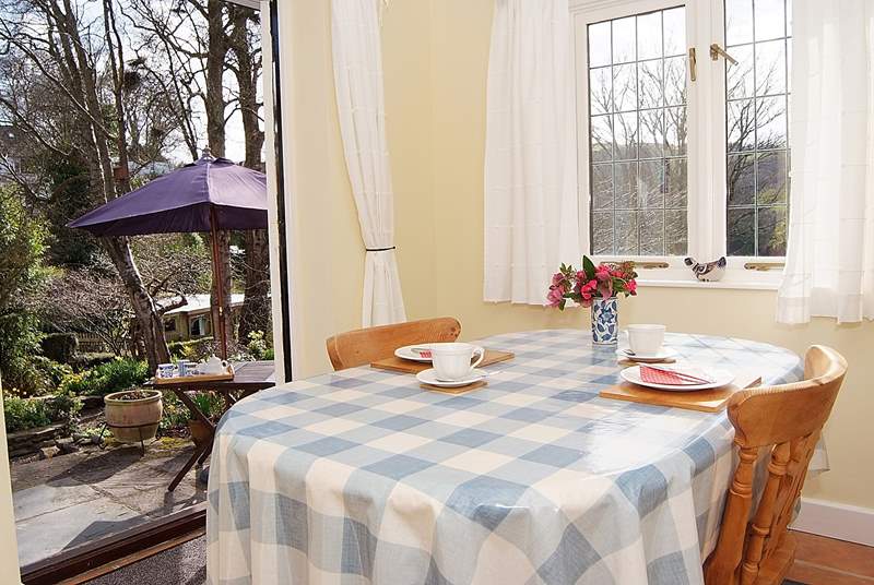 With windows on two sides and French doors to the garden, the dining-room is a bright and sunny room.