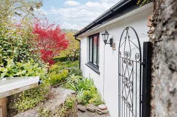 This is the path to the cottage from the road where you can drop off your luggage. Parking is just 100 yards away in the village centre - there is a dedicated space for you.
