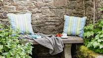This tranquil place to sit is tucked away in a little corner next to the stream.