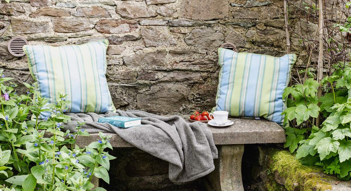 This tranquil place to sit is tucked away in a little corner next to the stream.