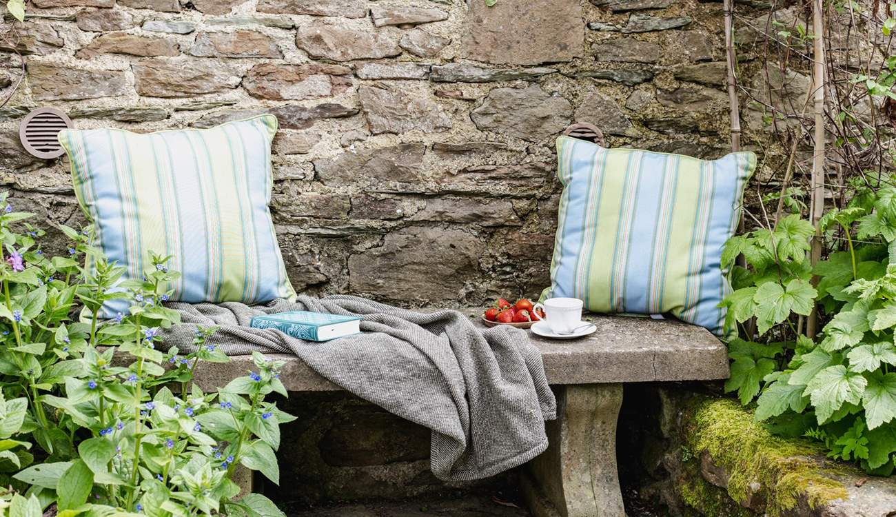This tranquil place to sit is tucked away in a little corner next to the stream.