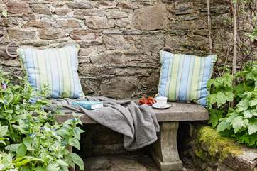 This tranquil place to sit is tucked away in a little corner next to the stream.