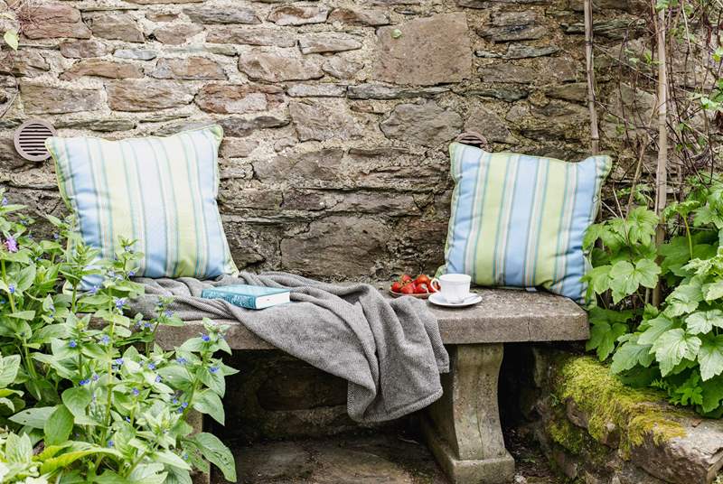 This tranquil place to sit is tucked away in a little corner next to the stream.