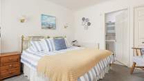 The bedroom can be made up as a super-king or twin, and has an en suite shower-room.