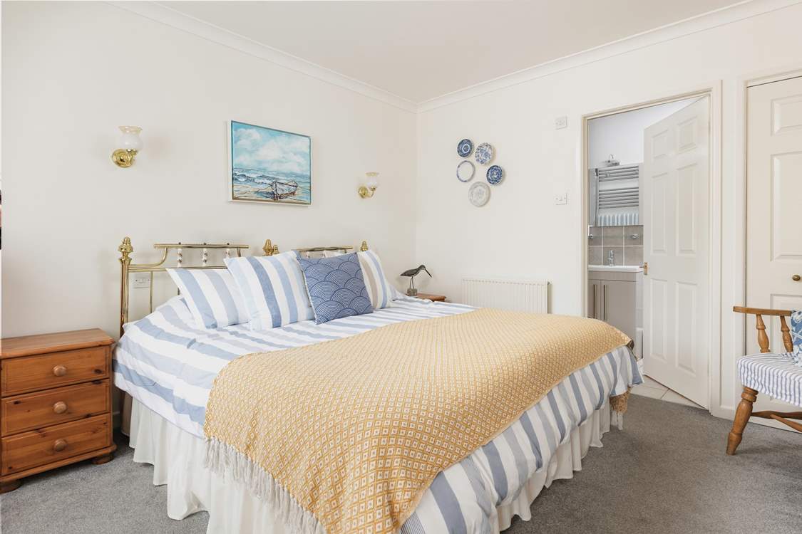 The bedroom can be made up as a super king or twin, and has an en suite shower-room.