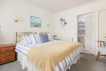 The bedroom can be made up as a super king or twin, and has an en suite shower-room.
