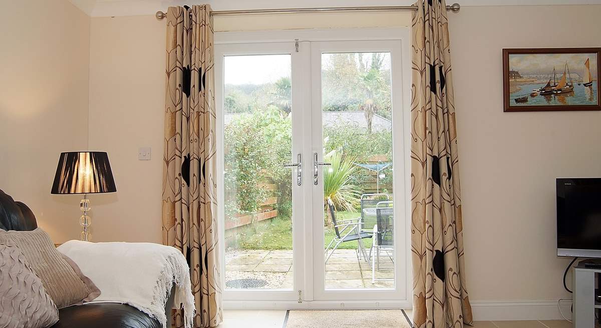 French doors lead out to the enclosed rear garden.