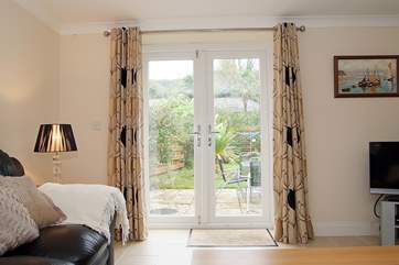 French doors lead out to the enclosed rear garden.