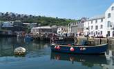 Fishing boats unload on Mevagissey harbourside. - Thumbnail Image