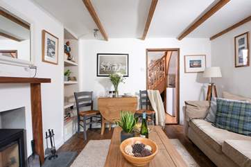 The lovely sitting room has a sweet dining table.