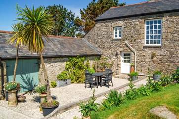 Little Trebarvah's south-facing garden is a peaceful spot from which to admire the countryside views (the patio is now slate and new photos to follow).
