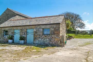 The entrance to the cottage parking with the laundry-room for Little Trebarvah in the single-storey barn on the left, the owners share access at the bottom of this drive.