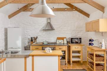 The lovely kitchen has everything you need.
