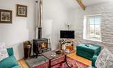 Sink into the sofas in front of the wood-burner. - Thumbnail Image