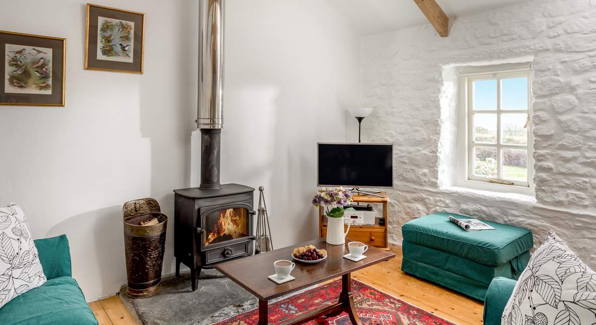 Sink into the sofas in front of the wood-burner.