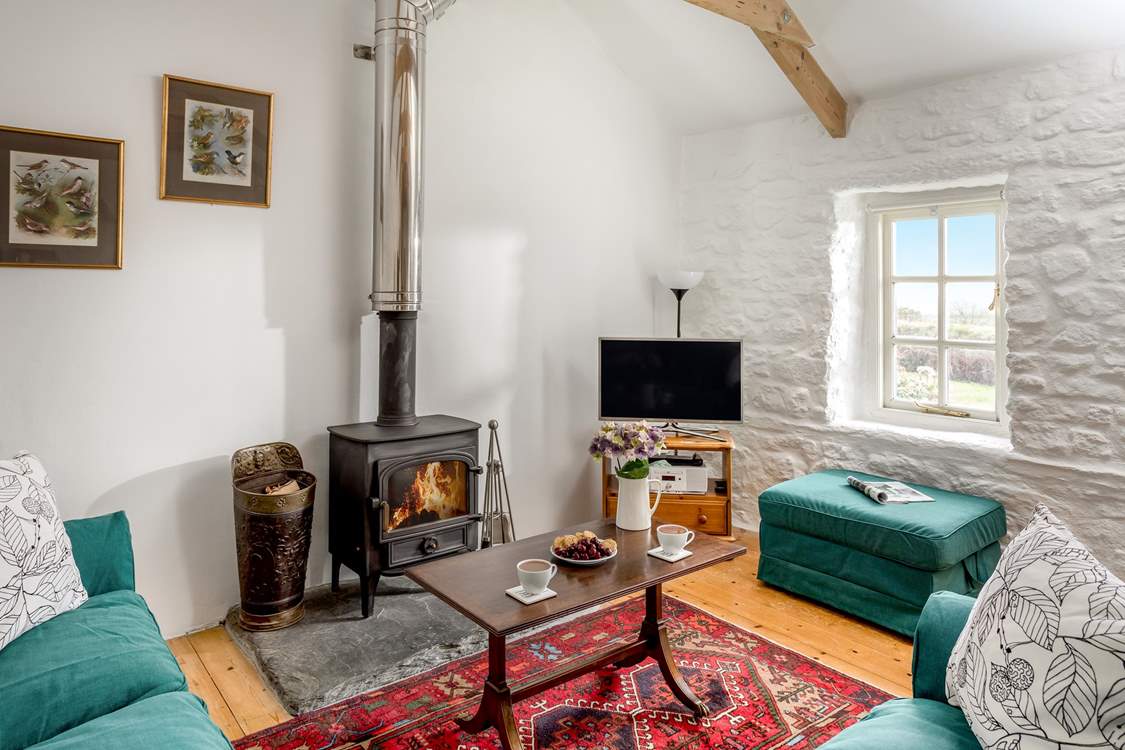 Sink into the sofas in front of the wood-burner.