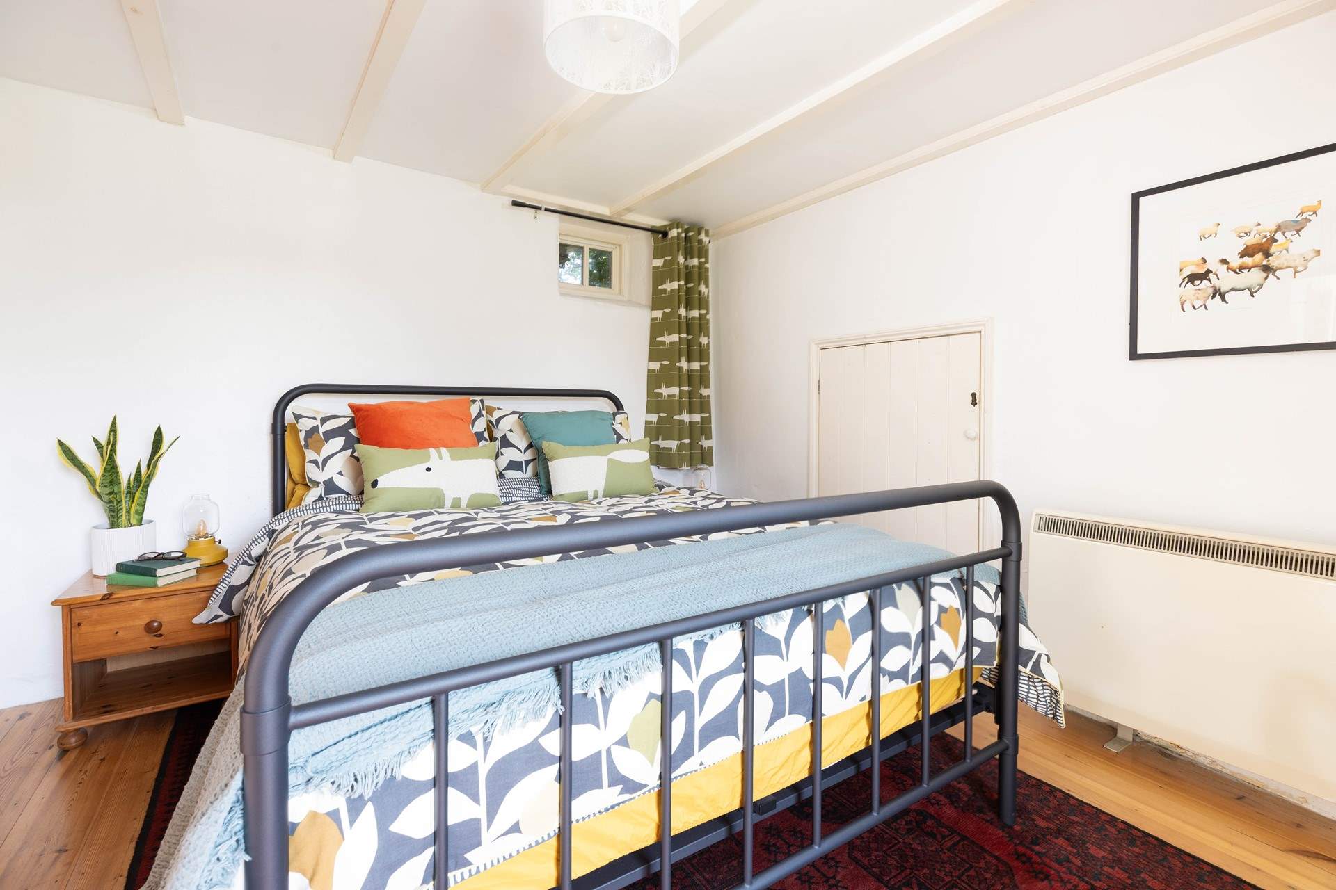 Bedroom 1 has fun decor. 