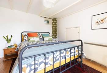 Bedroom one has fun decor. 