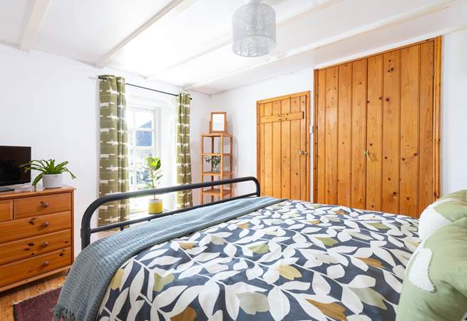 This bedroom has a fabulous window out to the patio. 