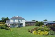 From the left: the farmhouse with the annexe hidden behind, the owners' private museum (not open to the public) and the roof of Aveton Cottage (2355) with the pool-room in front.