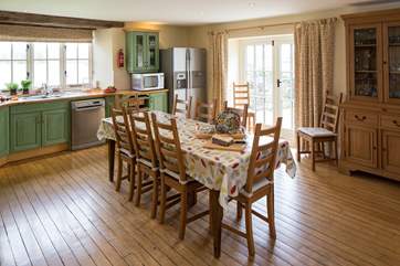 The very spacious kitchen/diner has doors out to an enclosed patio.