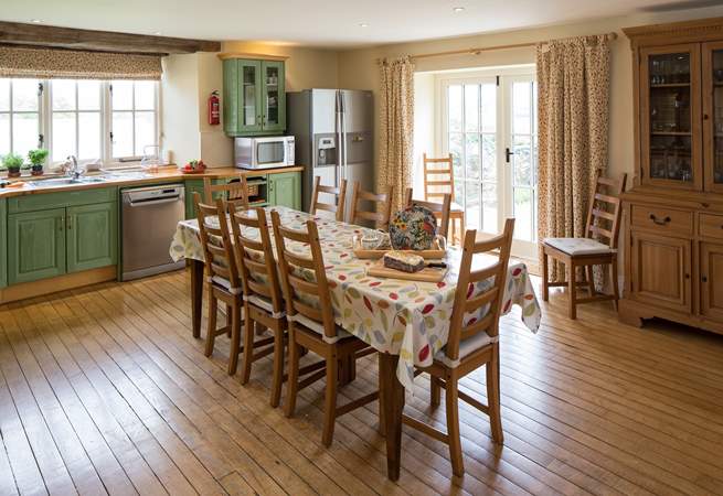 The very spacious kitchen/diner has doors out to an enclosed patio.