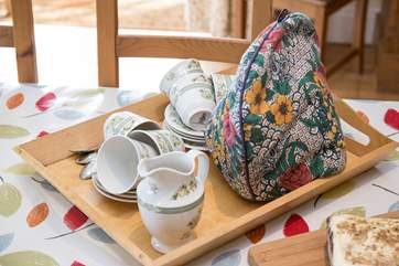 A welcoming fresh cake and a pot of tea.
