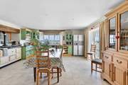 The spacious kitchen has a homely charm to it.