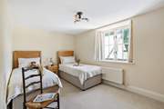 Bedroom five is home to two delightful single beds.