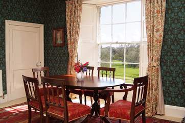 The dining-area within the first floor sitting/dining-room (you can just see a doorway to the left which leads through to one of the twin bedrooms).