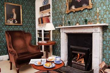 The open fire in the first floor sitting/dining-room.