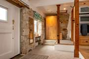 The bathroom is up the two steps in this quirky property.
