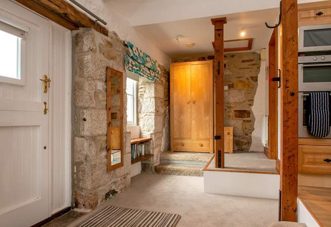 The bathroom is up the two steps in this quirky property.
