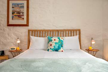 Snuggle up under the crisp sheets.