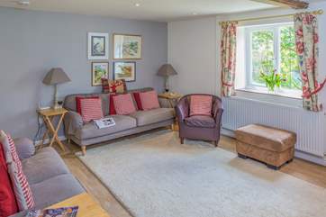 Stairs lead from the sitting-room and a door at the foot of the stairs is for the ground floor bedroom.