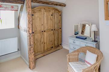 Bedroom 2 has real character; exposed beams create storage and a dressing-area.