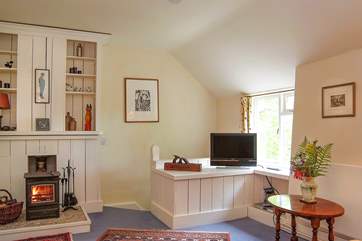 The sitting-room has a wood-burner.