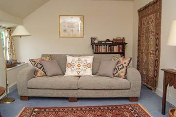 Snuggle up on the comfortable sofa.