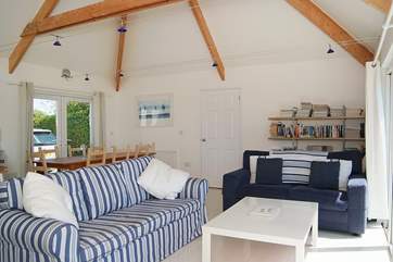Three comfortable sofas face the patio doors.
