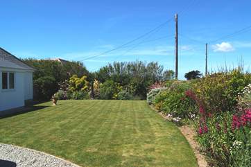 The front garden's flower borders are full of colour throughout the summer.